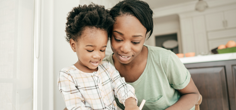 a woman and a child doing an activity together