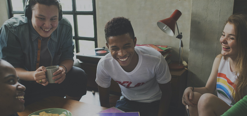a group of teens laughing together